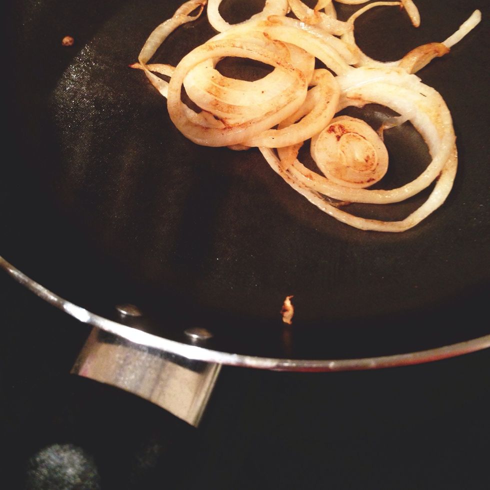 Heat onion in pan until golden