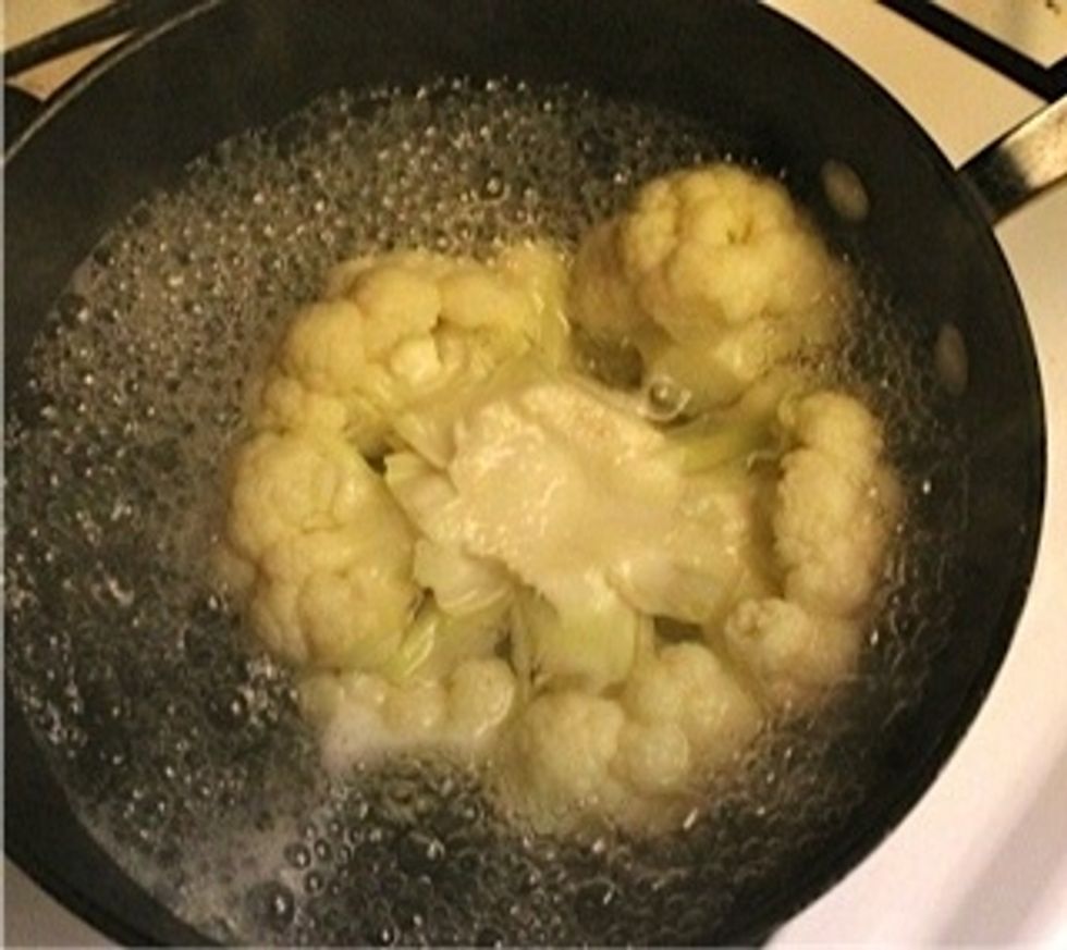 Heat oven to 350 degrees. Once the water is boiling, put and cook cauliflower for 10 mins. Turn it around for 5 mins each if the water doesn't cover the entire cauliflower.