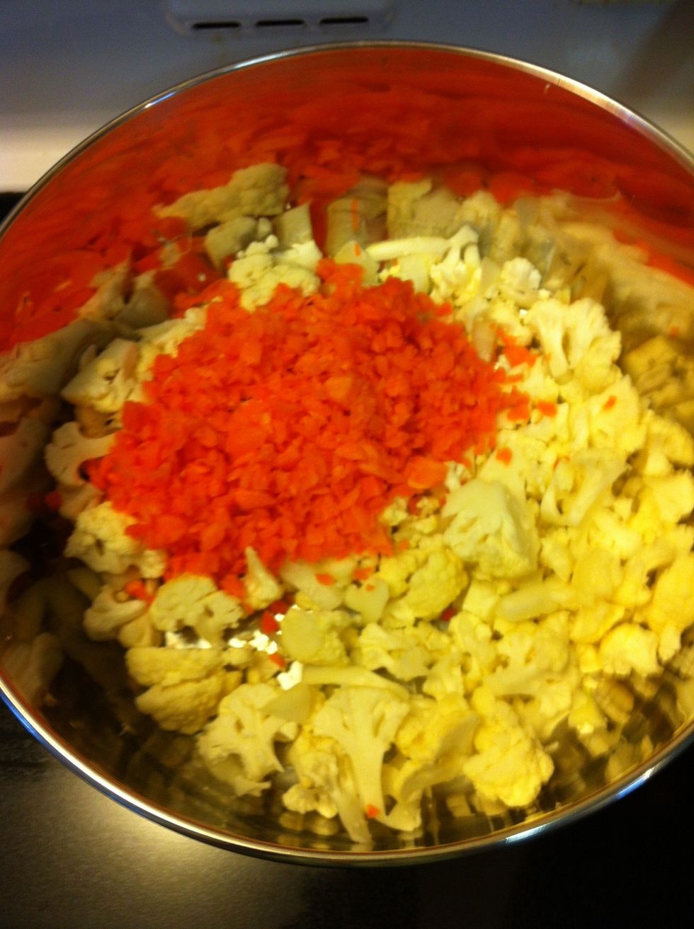 Heat over medium heat: Oil, cauliflower, carrot until cooked through