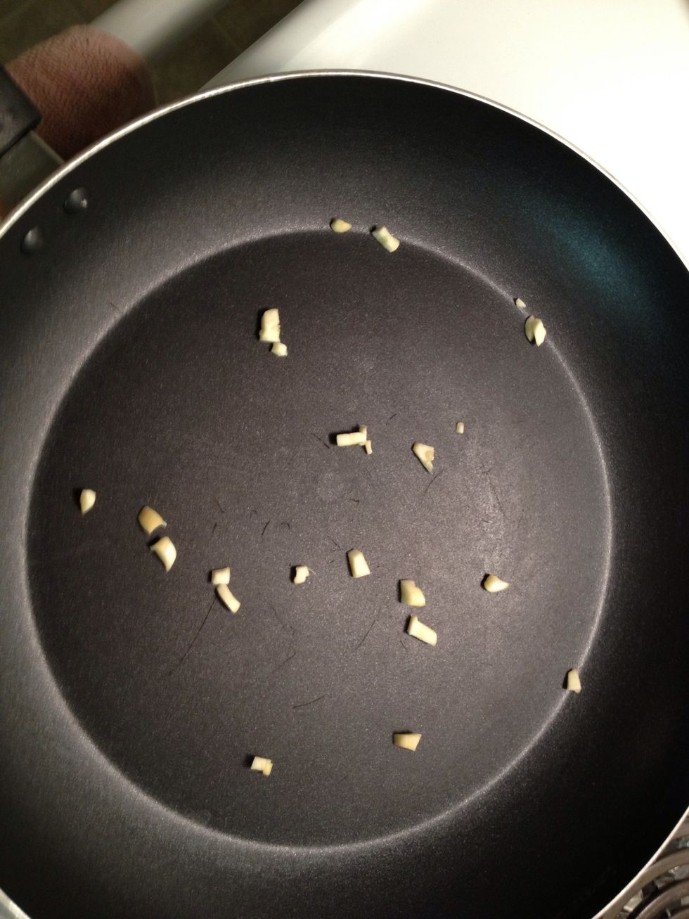 Heat pan and add garlic