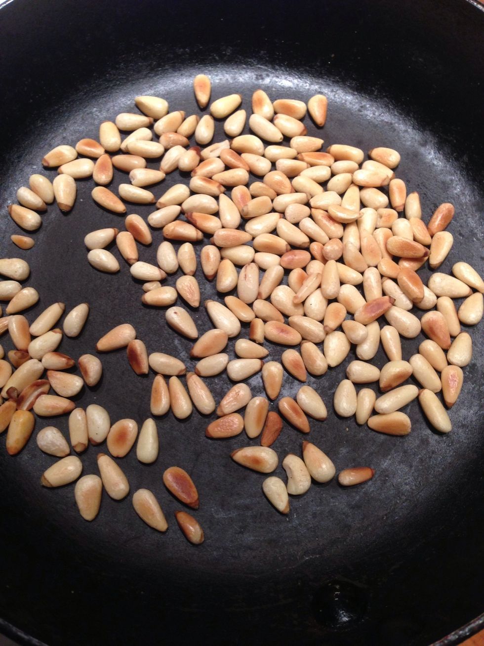 Heat pan. Toast the pine nuts until golden brown. Make sure you constantly stir the pine nuts. Once completed, set aside.