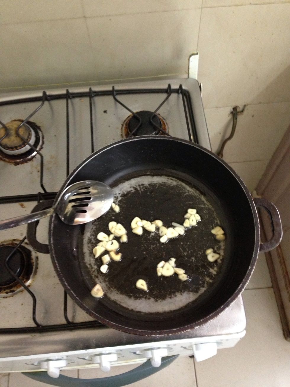 Heat pan with oil and put garlic first.