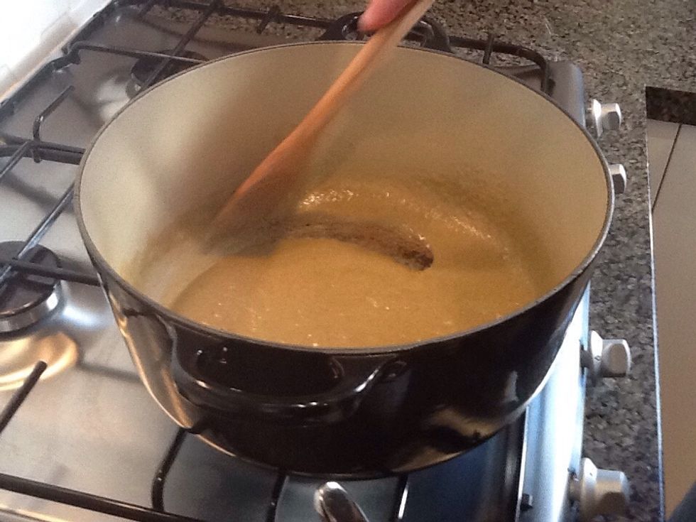 Heat pot on medium heat. Heat the two tablespoons of vegetable oil and half of the coconut cream, then add curry paste and stir to combine