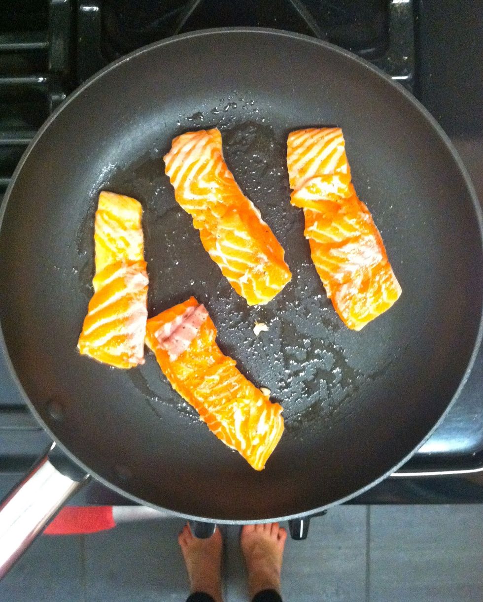 Heat remaining teaspoon of oil in a nonstick skillet over med-high heat. Season the salmon with 1/4 teaspoon each salt & pepper and cook until opaque, 3-4 minutes per side.