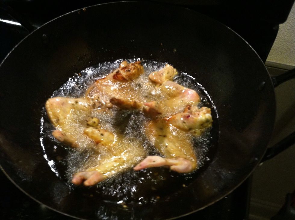 Heat some oil , it needs to be very hot before you add the chicken wings.