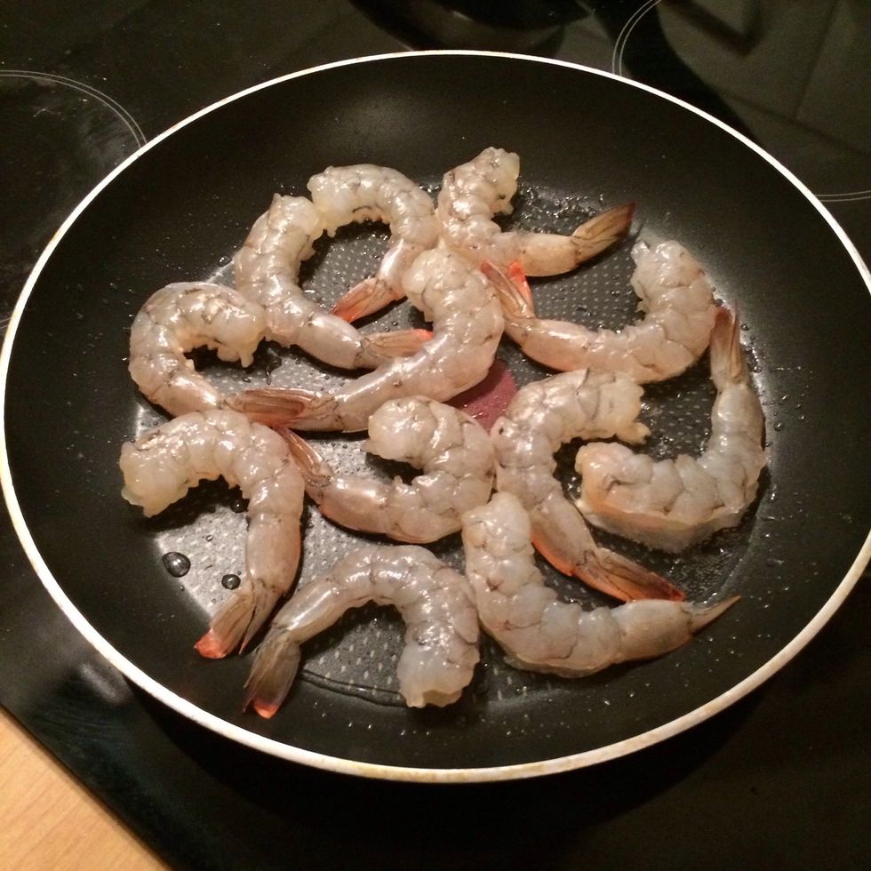 Heat some sunflower seeds oil in a non stick pan. Throw in the shrimps