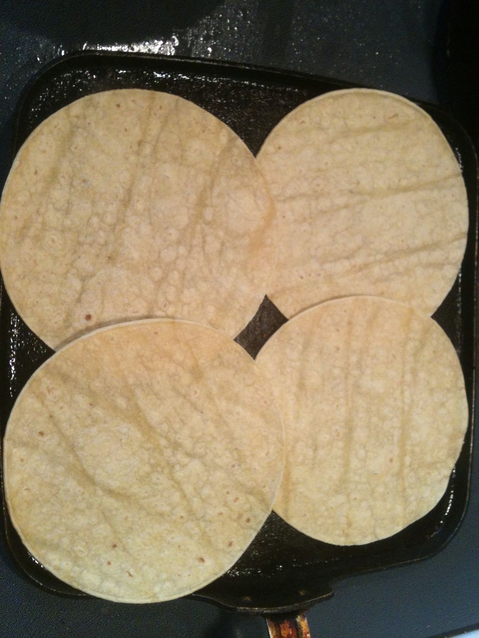 Heat some tortillas in the same pan.