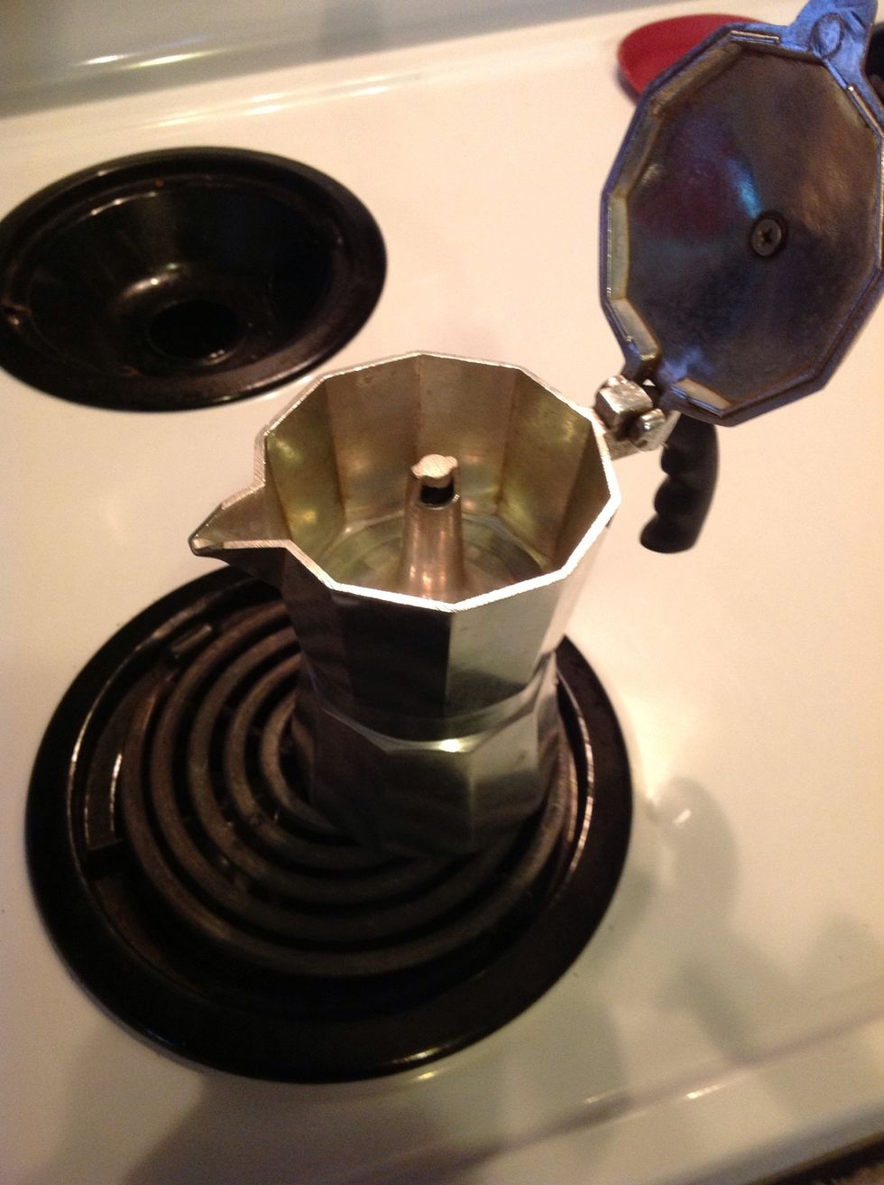 Heat stove top on high heat, place espresso pot and heat