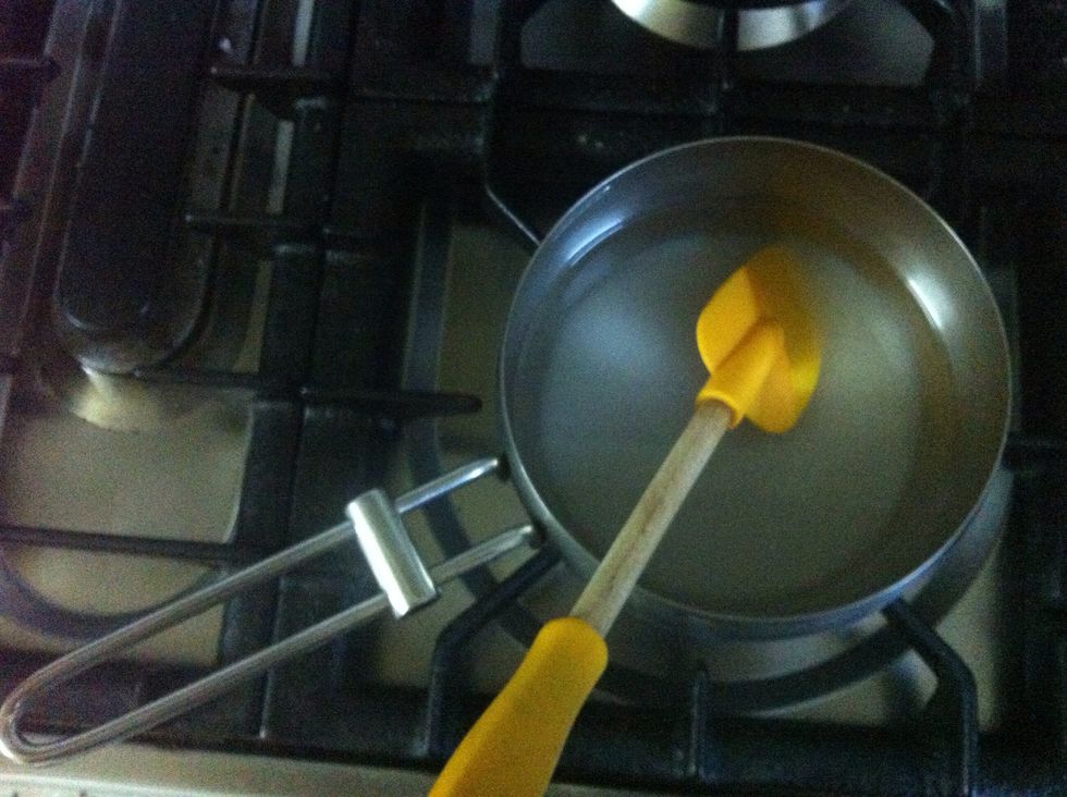 Heat sugar and water and keep stirring until sugar is completely dissolved