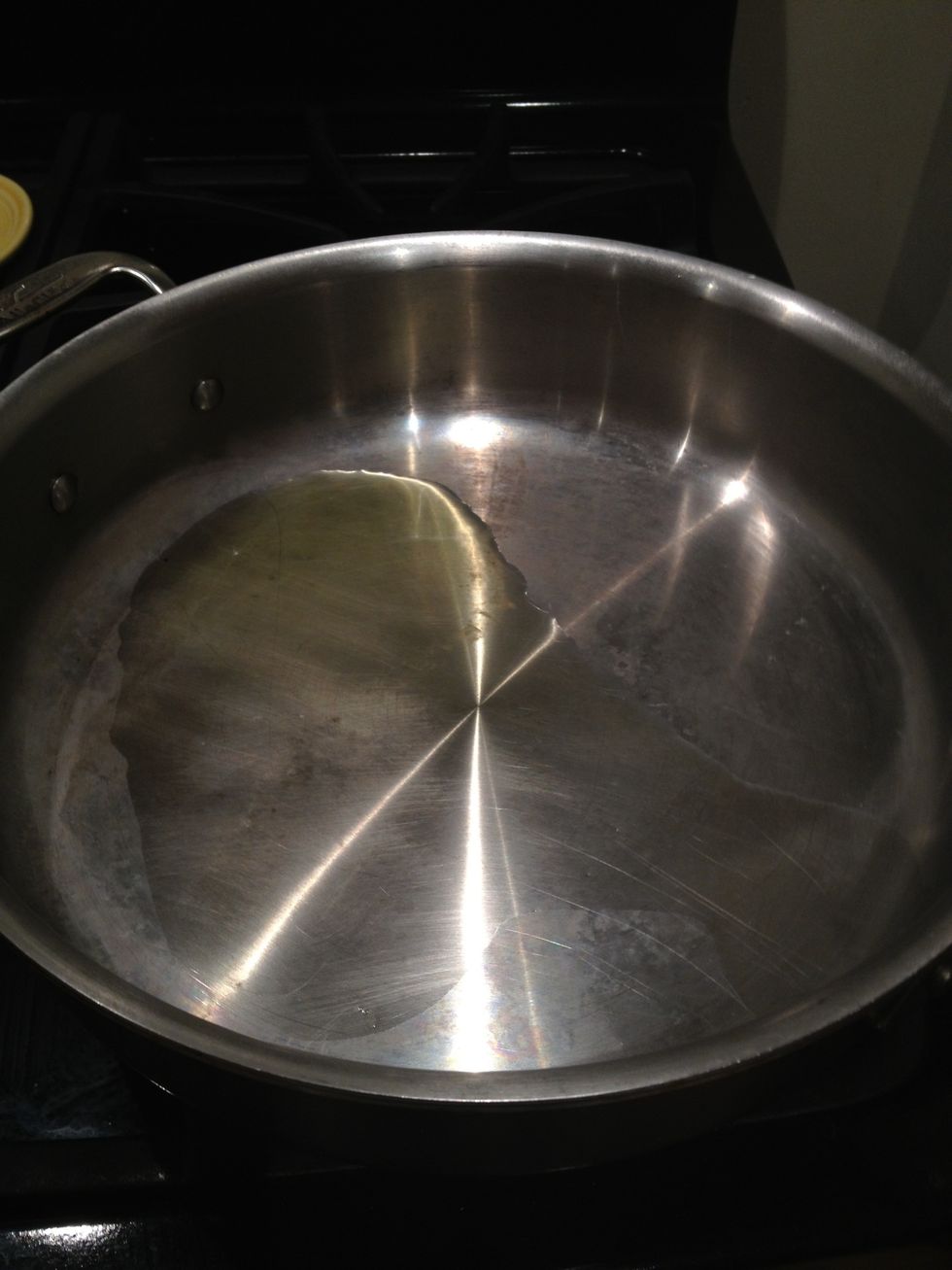 Heat the 3 Tablespoons of olive oil over medium high heat, in the largest skillet you have.