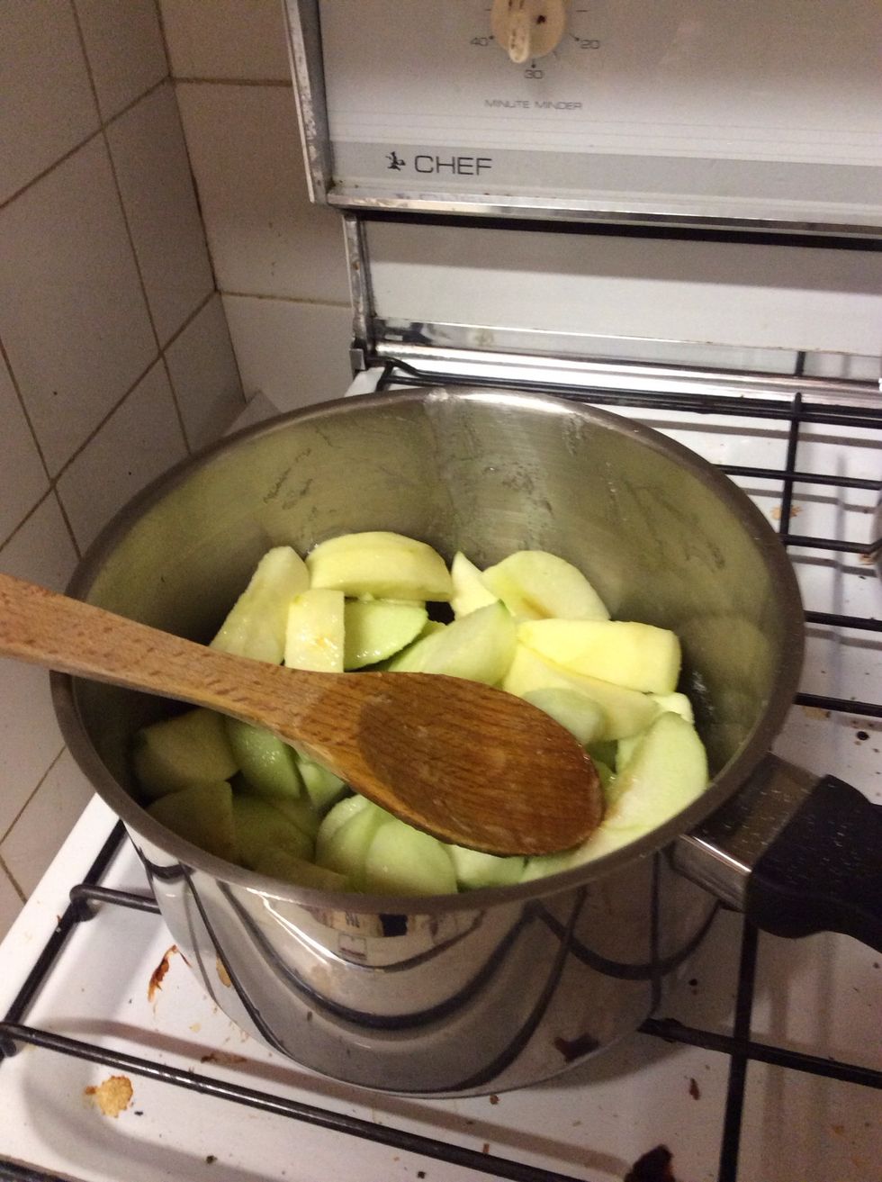 Heat the apple mixture on medium heat on the stove. Keep stirring the apples so they all get evenly cooked. Juices will come out of the apples. Heat until apples are firm but still hold their shape.