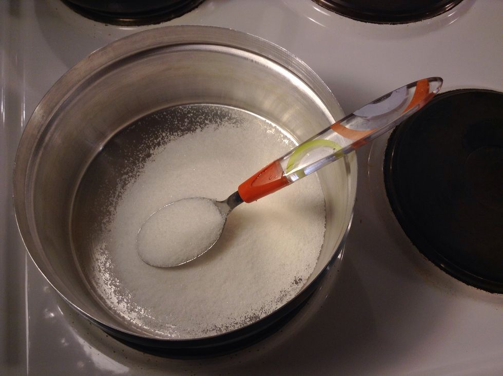 Heat the burner to medium heat and pour the sugar into the can