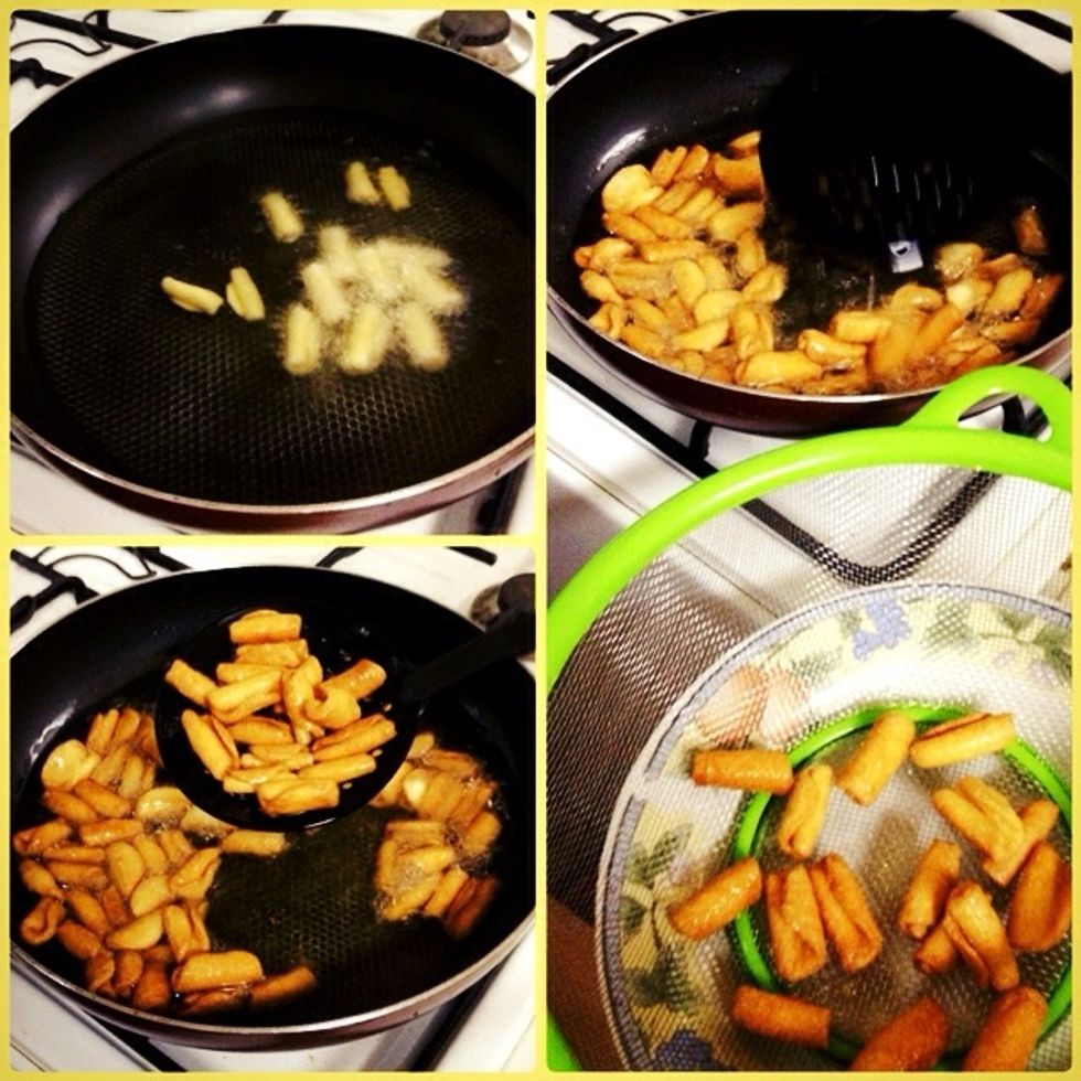 Heat the clean oil and put the dough so that it becomes golden colour remove them and put them in a colander.