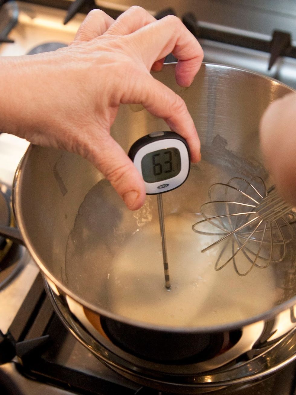 Heat the egg whites and the sugar whisking constantly. Keep an instant read thermometer nearby, as you want to get the mixture you're whisking up to 115 degrees.