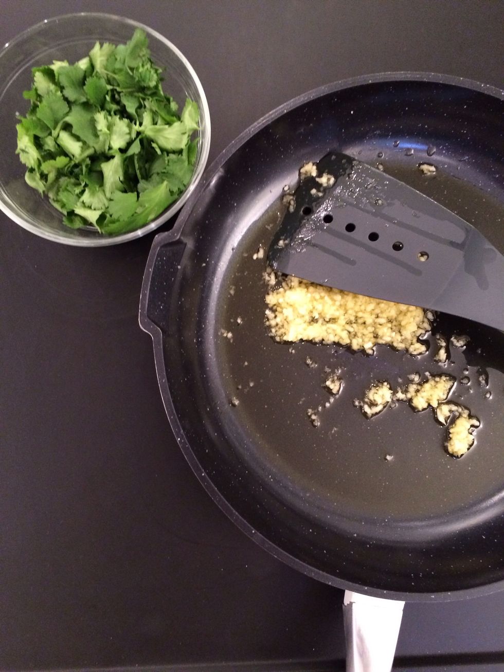 Heat the garlic until fragrant