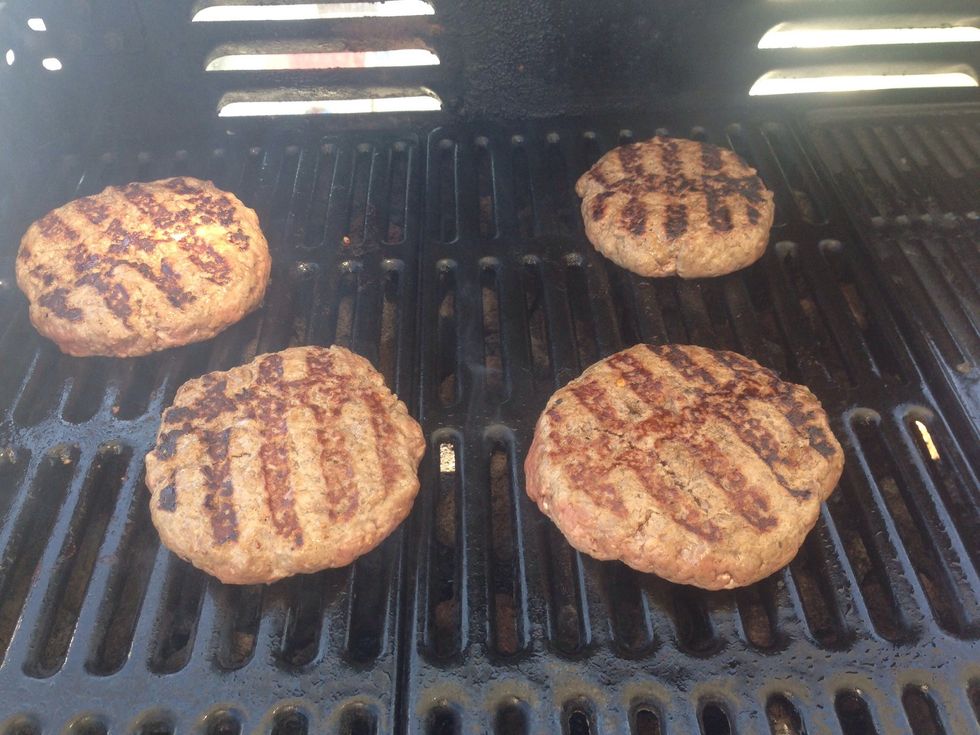 Heat the grill to a maximum temp and toss the patties on for 2 minutes, then flip. Continue flipping and rotating so you get grill marks throughout (that's where all the flavour is!)