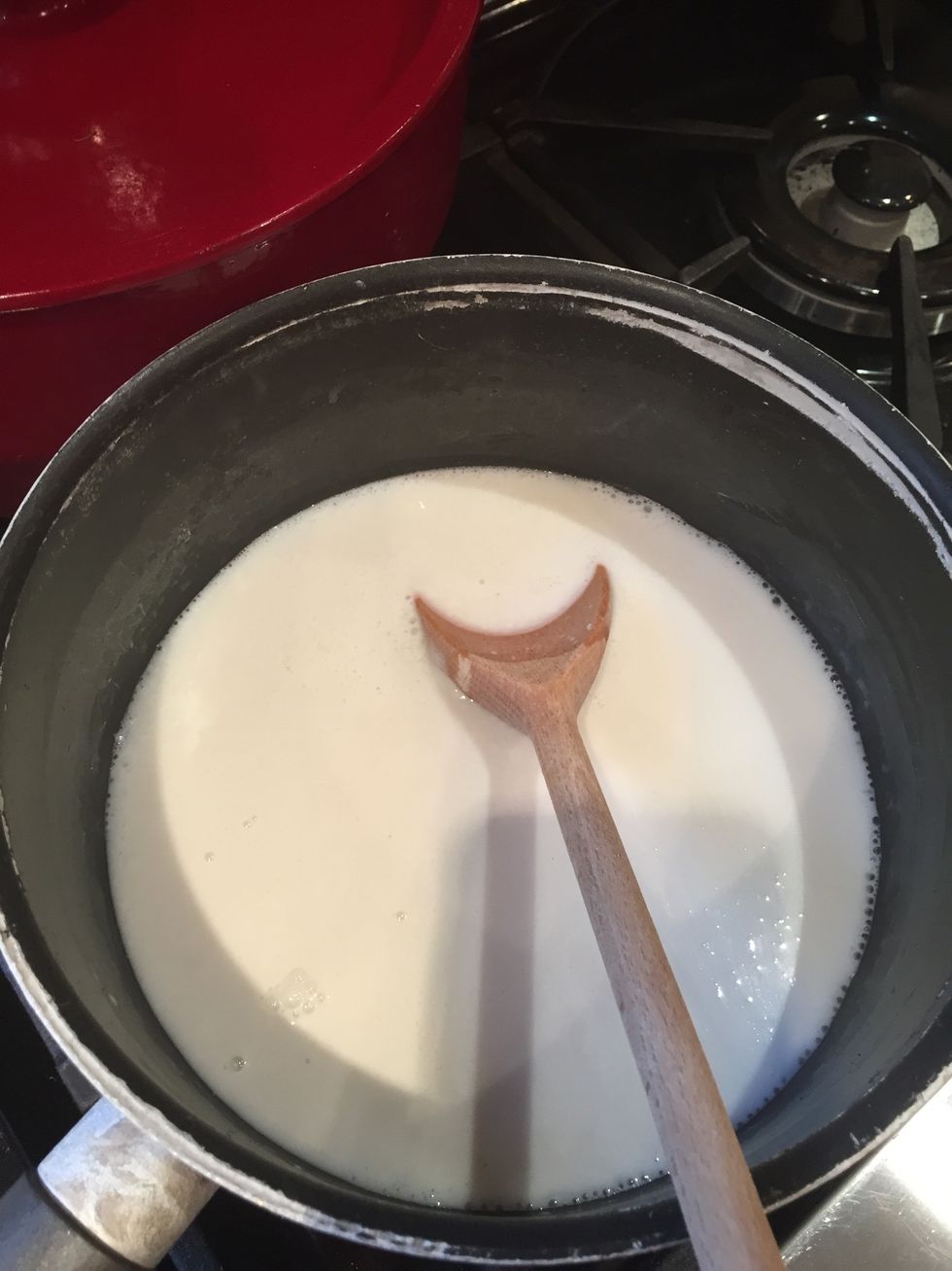 Heat the milk, coconut milk and sugar in a pan until it starts to bubble