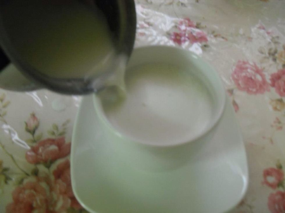 Heat the milk to boiling , then pour one cup of it in the cup .