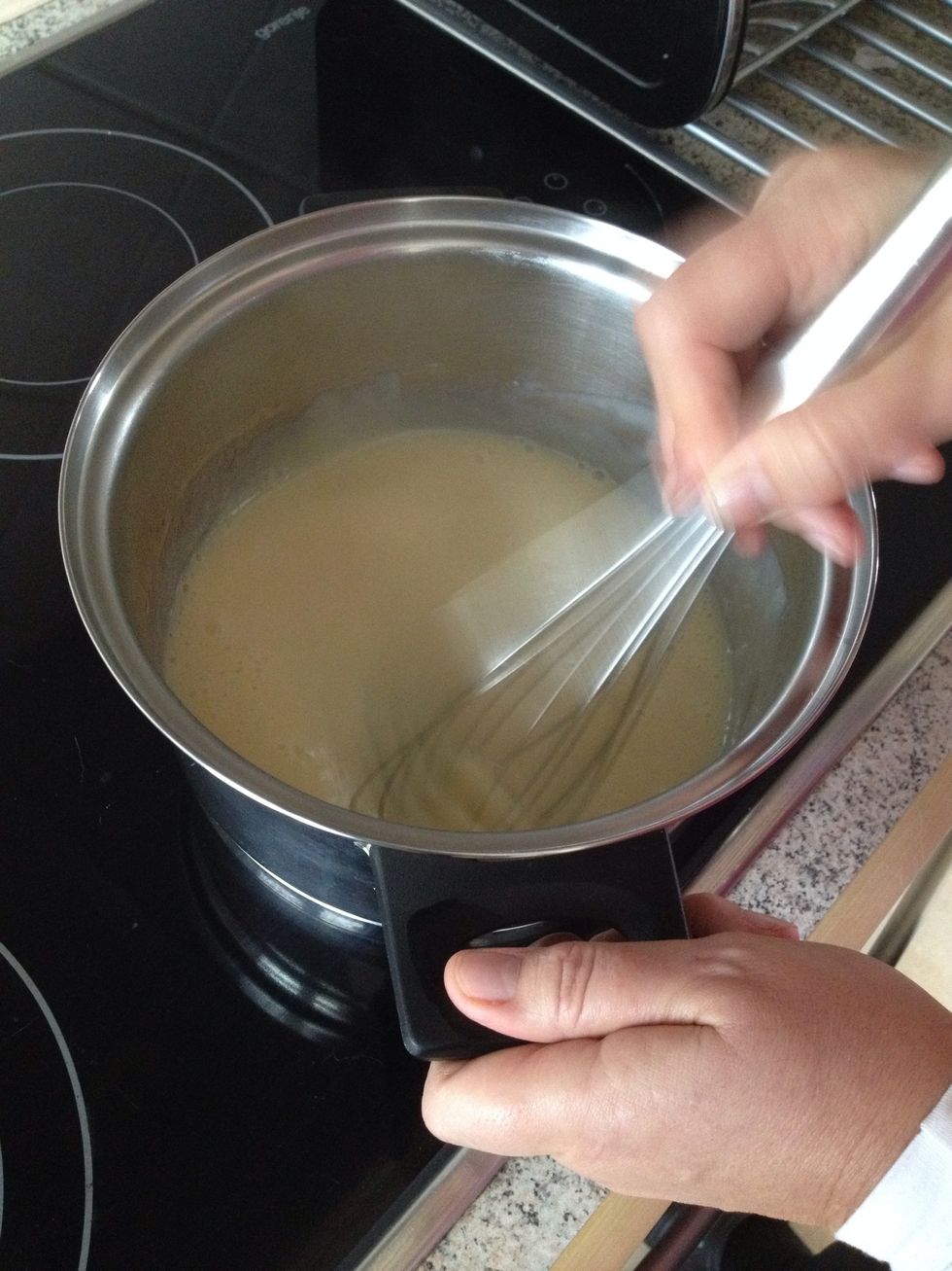 Heat the milk while whisking in it
