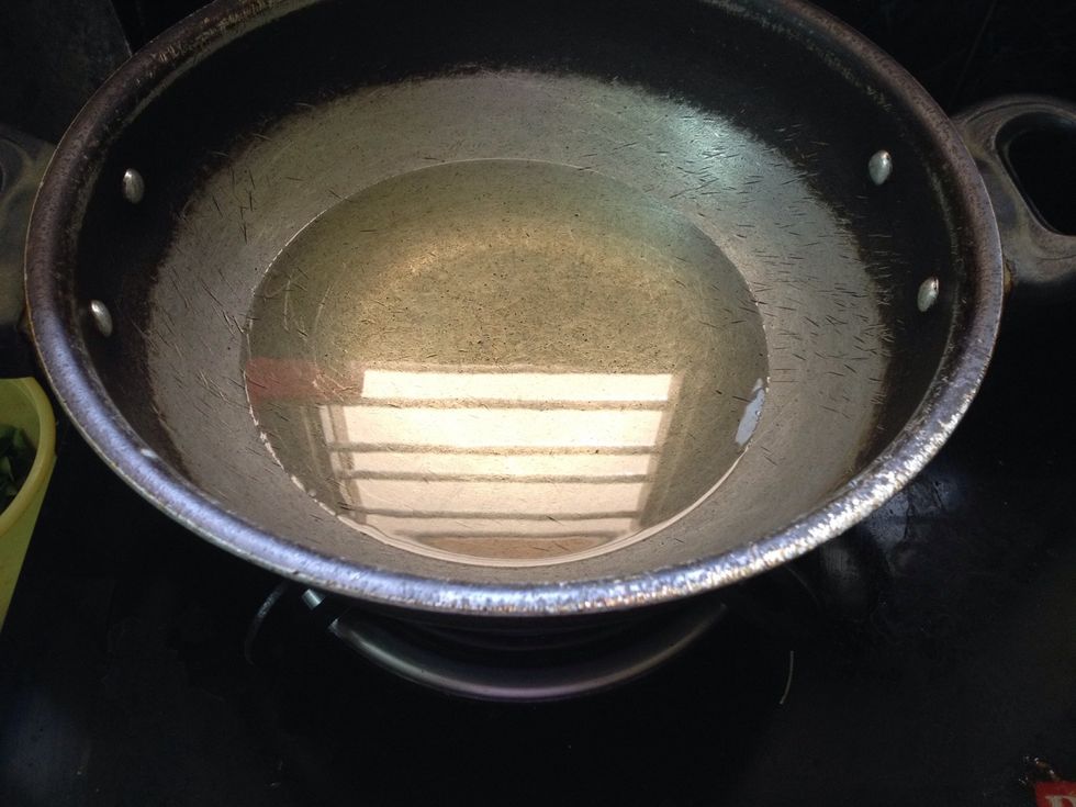 Heat the oil for deep fry of onions and chicken...