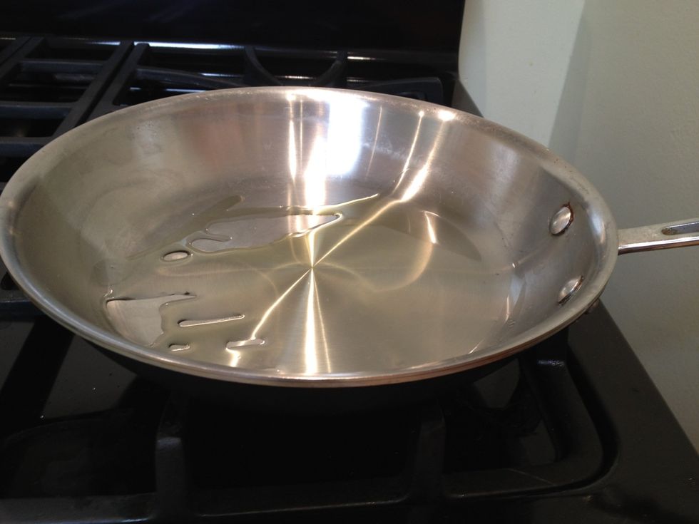 Heat the oil in a large, oven safe skillet.