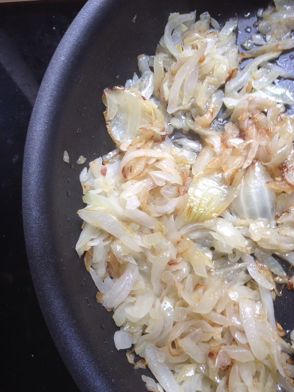 Heat the oil in a large pan. When hot - add the coarsly chopped onions. Fry until onion become transparent and a little brown at the edges. Don't overcook it! It will get more frying in the next stage