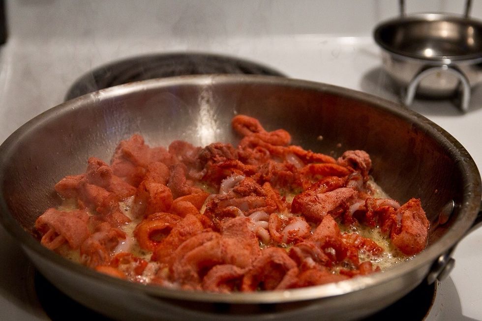 Heat the oil in a large shallow pan. Make sure the oil is very hot. You don't want the pan to cool to much when you add the squid. It's going to cook quick so stay near by.