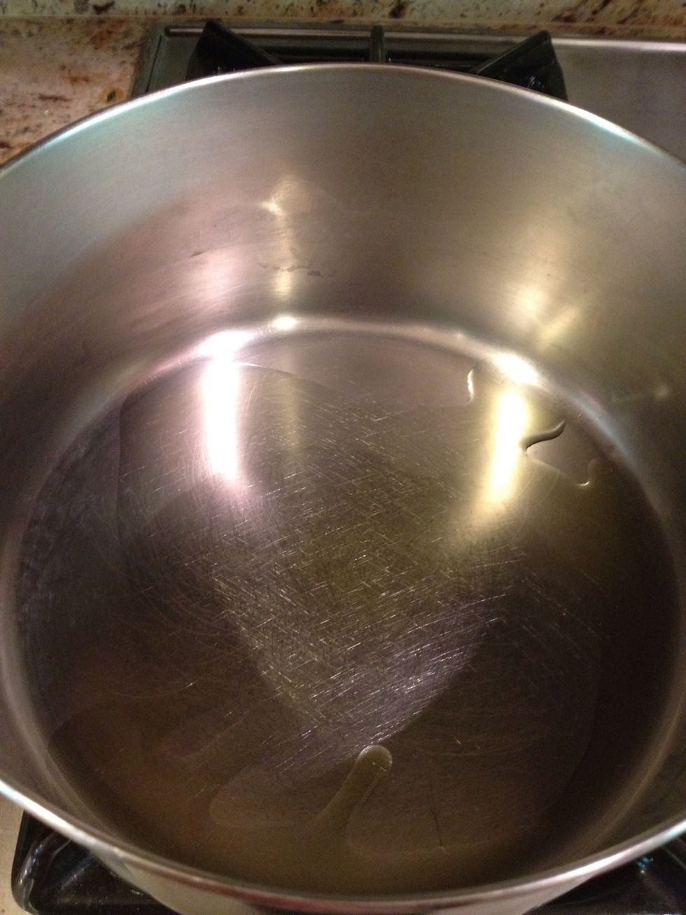 Heat the olive oil in a large saucepan over medium heat.