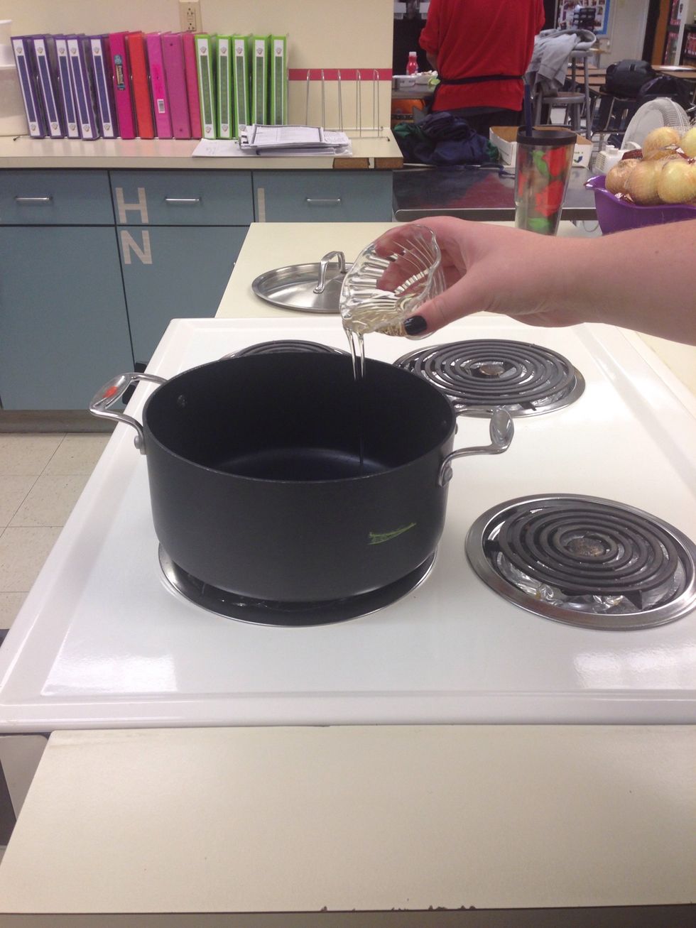 Heat the olive oil over high heat in a large stock pot