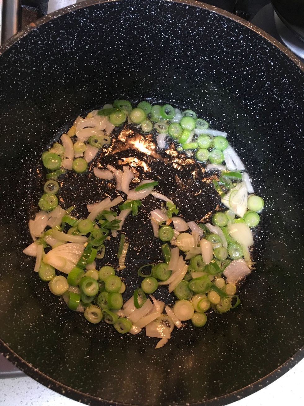 Heat the pan and put 2tsb of olive oil the sautee the green shallot along with onion