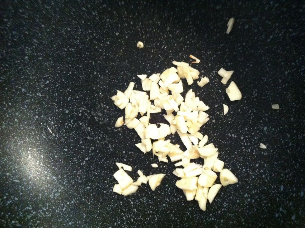 Heat the pan and then put oil. After the oil is hot add garlic and then stir fried.