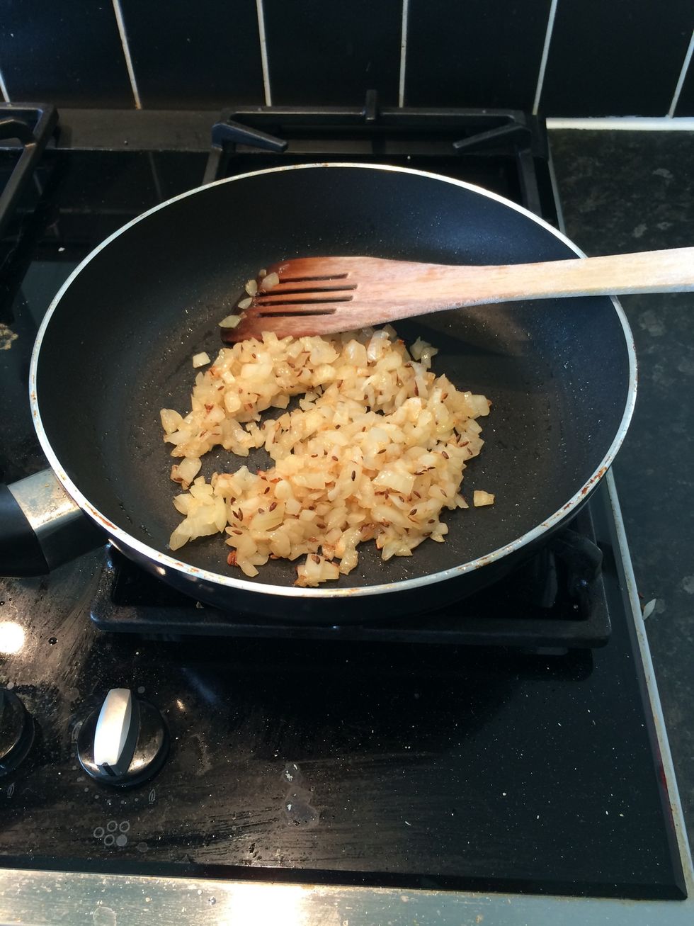 Heat the pan (med-high flame) with 3 tbsp of oil and add the onions when hot. Saut\u00e9 with tsp of jeera till golden brown. Approx 5 min Add tomato and let simmer for 7 mins till soft. Mash gently