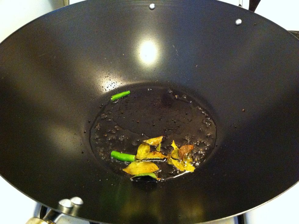 Heat the pan to medium, add olive oil, curry leaves (optional) and green chillies