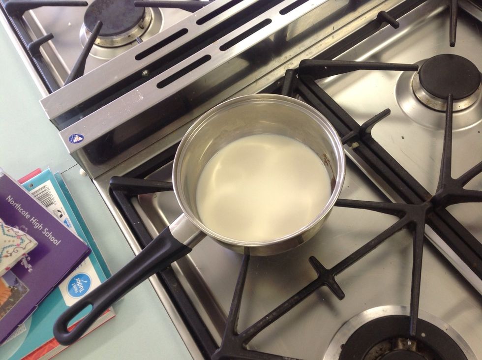 Heat the remaining milk in a small sauce pan until almost boiling.