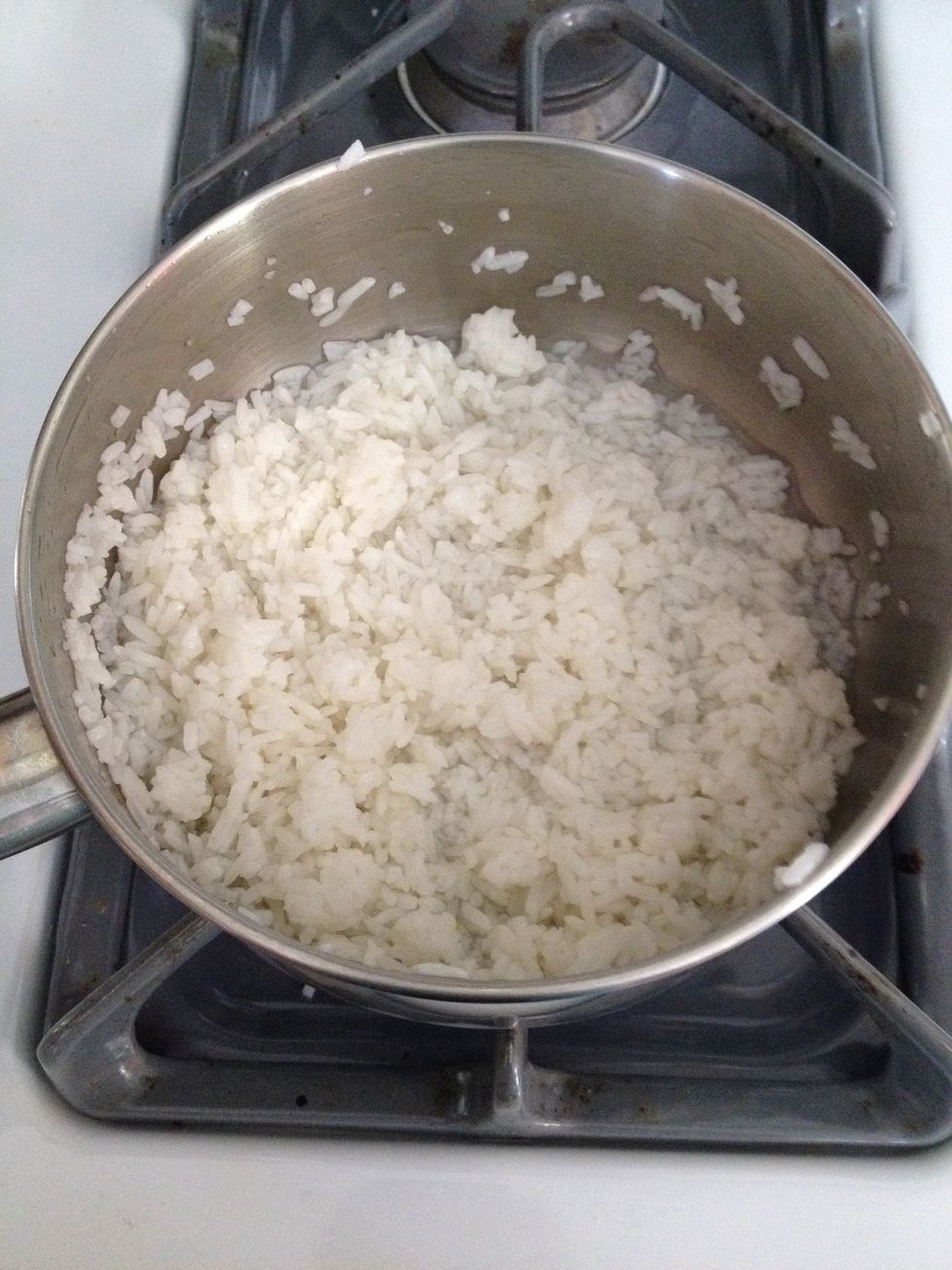 Heat the rice with the water until the water is almost gone and the rice looks creamy