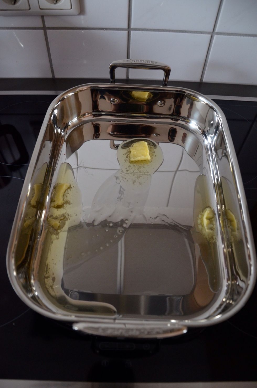 Heat the roasting pan in the oven or on the stove top and add a good amount clarified butter (in German Butterschmalz).