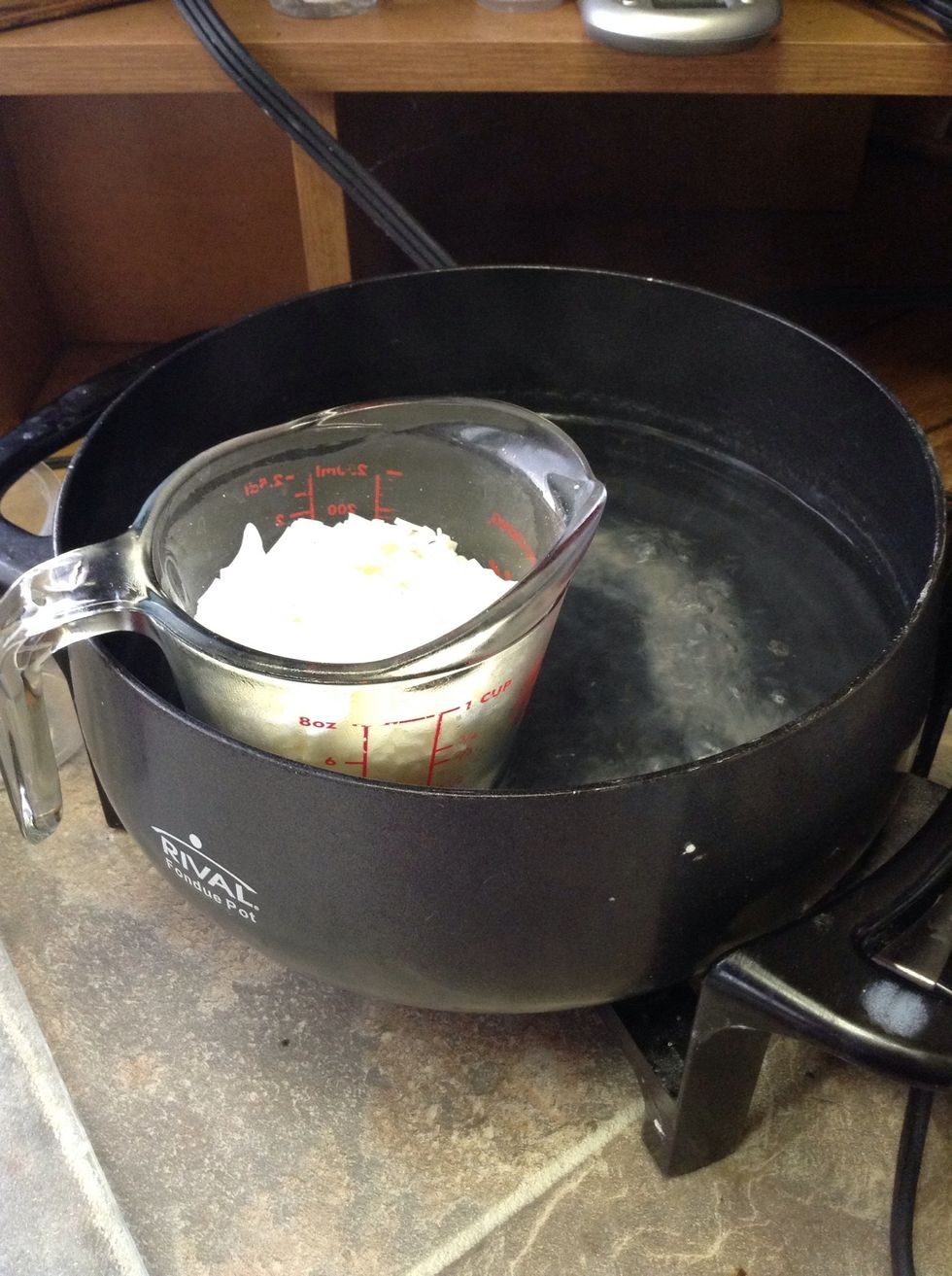 Heat the soy wax in a double boiler until completely melted. I don't recommend a microwave as it's just too unpredictable. Stir every once in a while. Remove from the heat when it's melted...