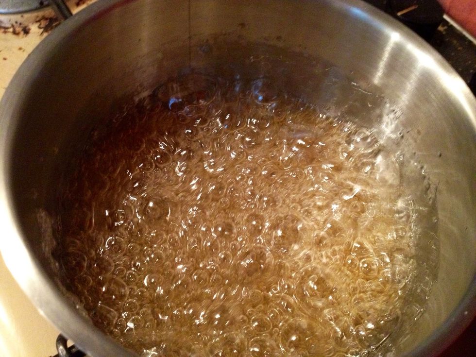 Heat the sugar and water to a broken caramel (140\u00b0C or 284\u00b0F).