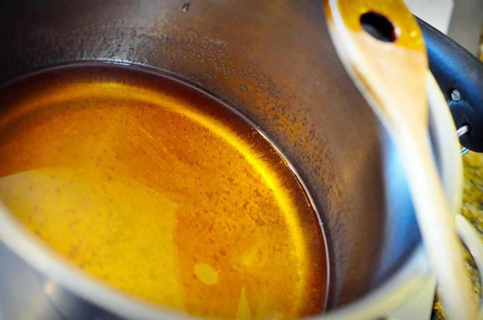 Heat the sugar mixture over medium high heat to dissolve the sugar and corn syrup into the tea.