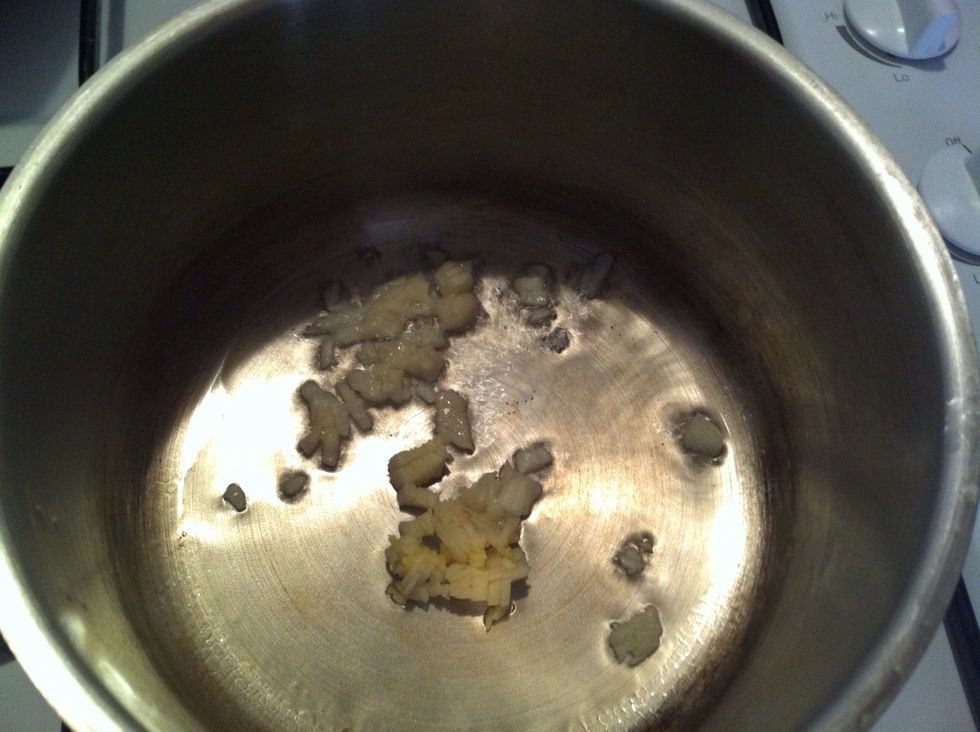 Heat the vegetable oil. Add chopped garlic & saut\u00e9 at low heat.