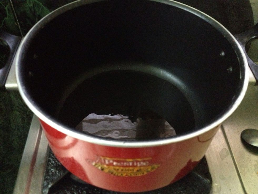 Heat the vessel with oil