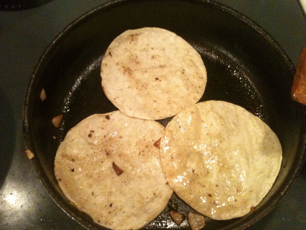 Heat tortillas in the same pan as the chicken. The pan should still have some oil left in it.