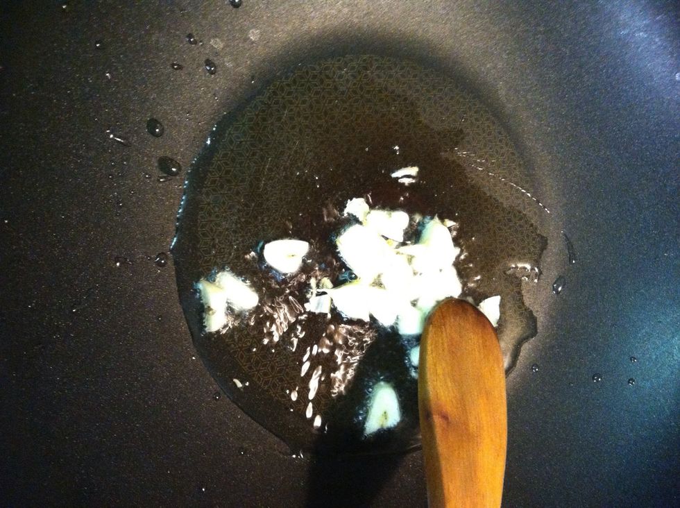 Heat true wok in medium heat put 1 table spoon cooking oil after the wok ready put the chop garlic in there