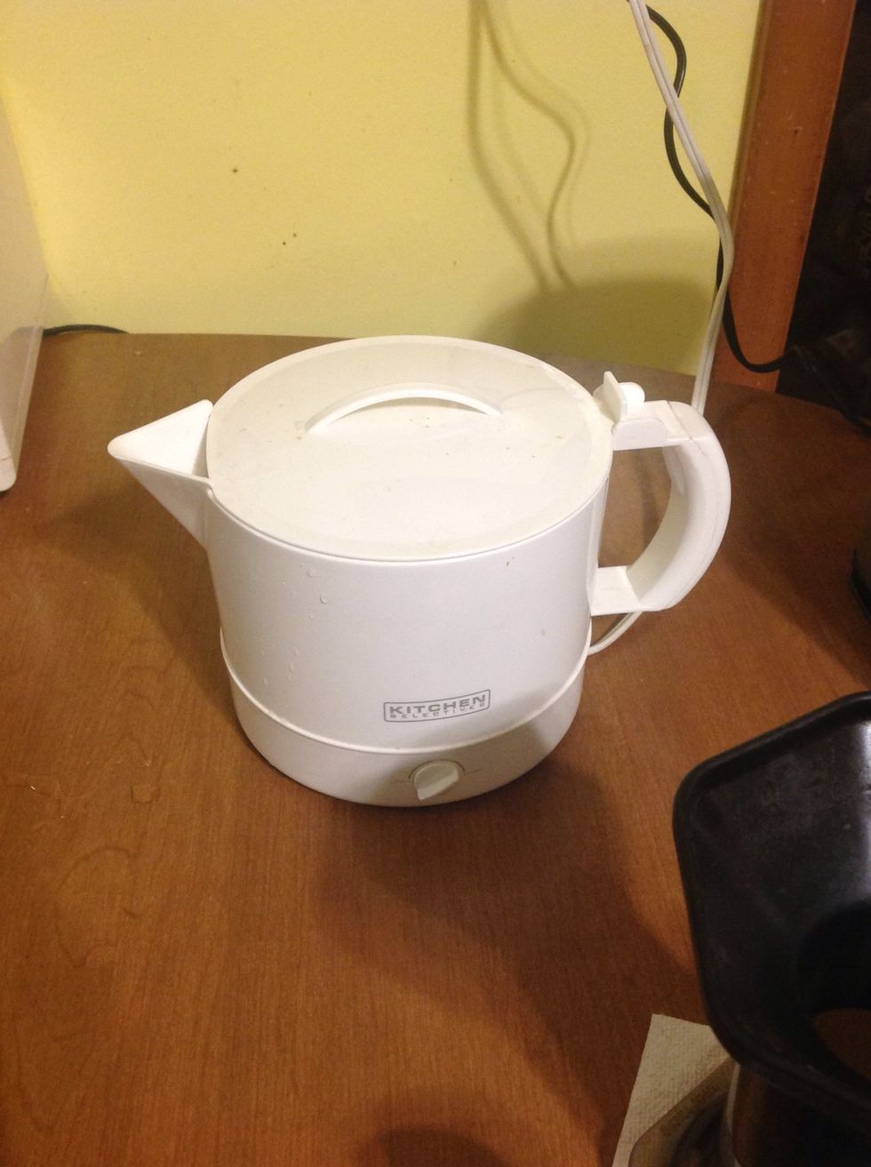 Heat up 8 to 12 ounces of water to approximately 180 degrees.