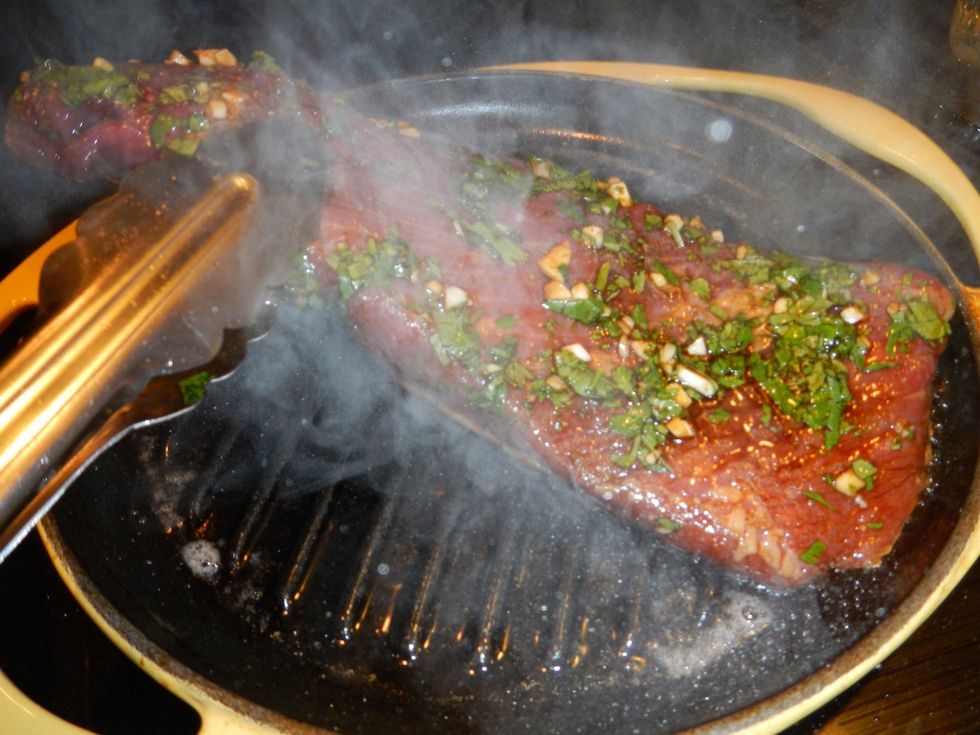 Heat up a grill pan over med-high heat. Sear the brisket on both sides