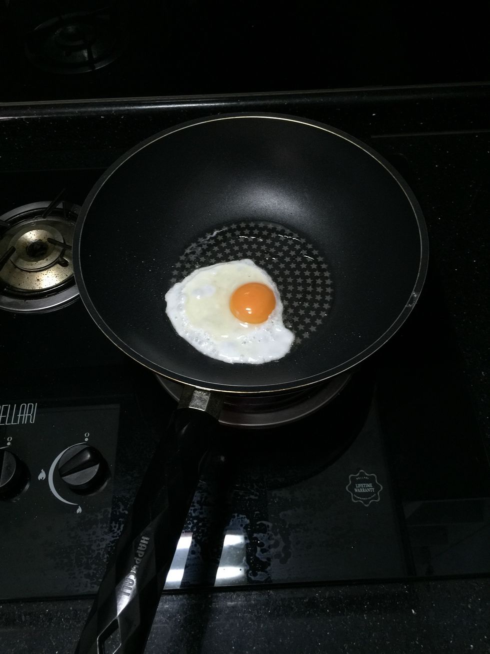 Heat up a non-stick pan, drizzle some oil and crack an egg. Don't over cook your egg and make sure you still have runny yolk.