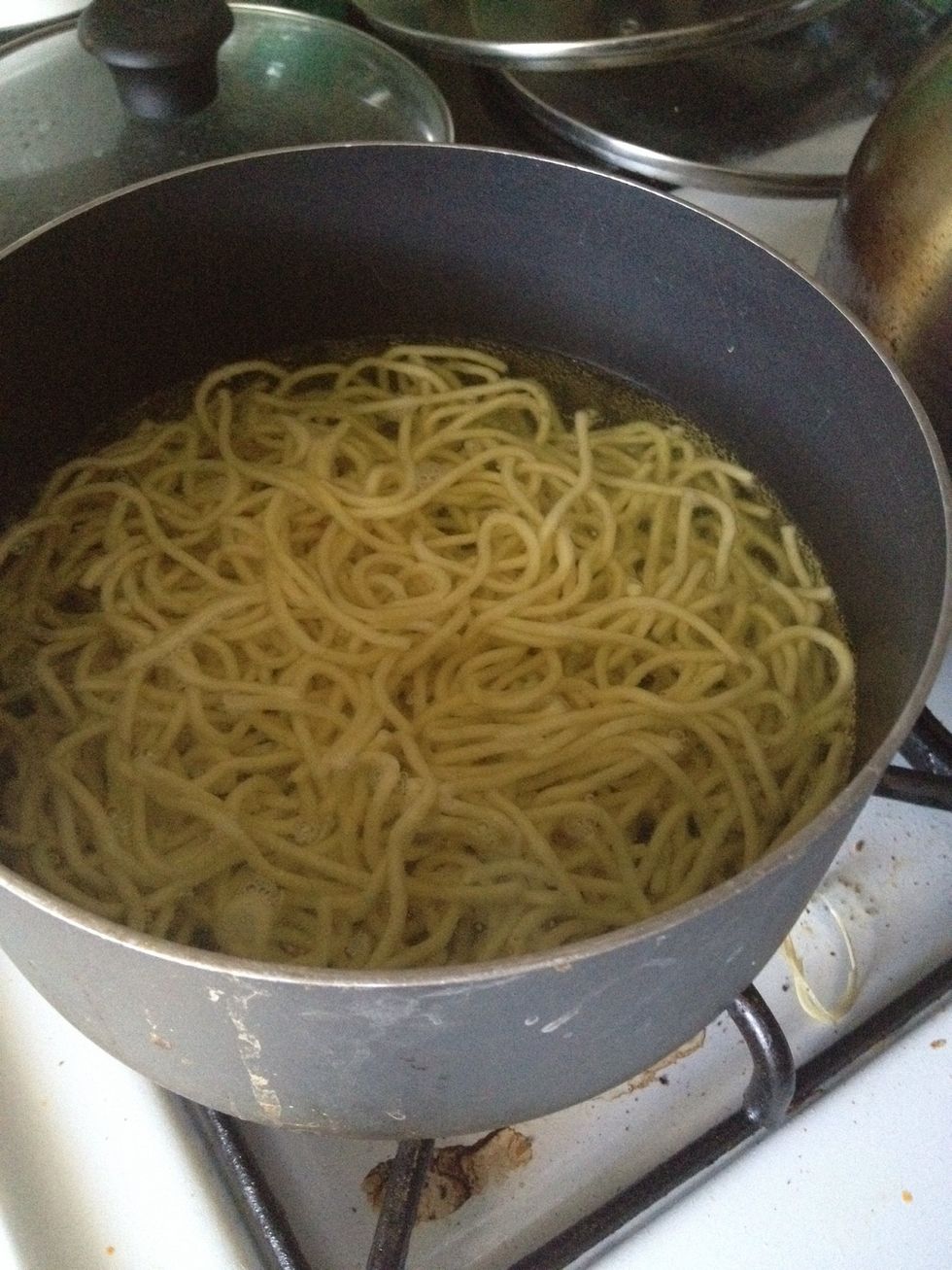 Heat up a pot of water until boiling. Add the noodles into the boiling water and cook the noodles unitl al dente, or for a few minutes.