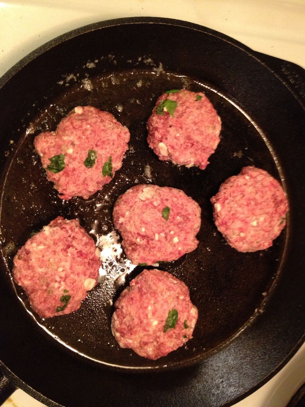 Heat up a skillet, add some butter. Fry the patties until golfen brown.