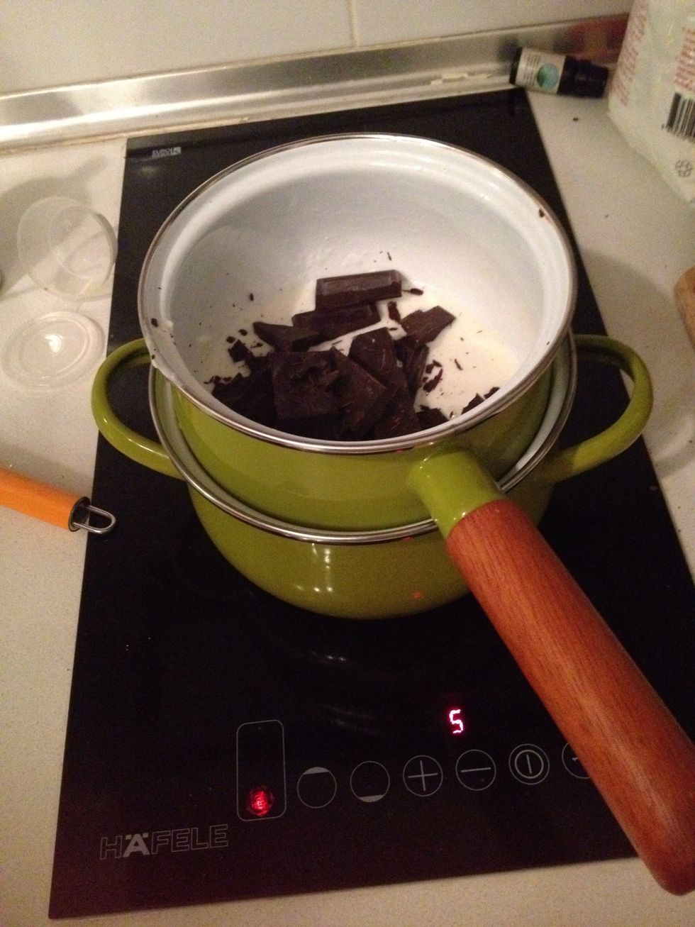 Heat up and combine cream and chocolate together into a Grenache. Make sure the water doesn't touch the bottom of the chocolate pot. And the water is simmered not rolling boiled.