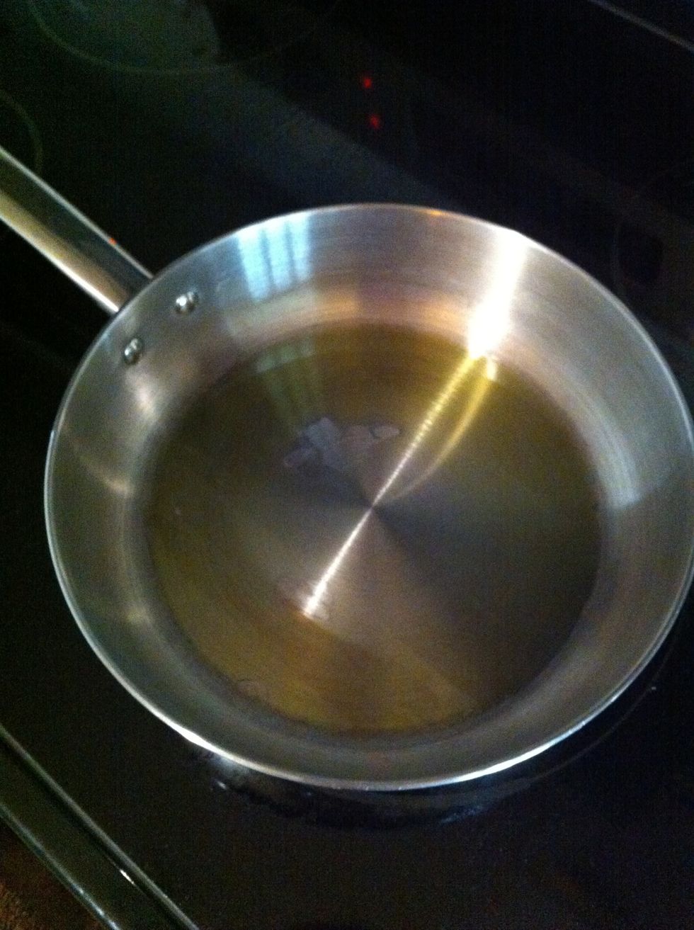 Heat up extra virgin olive oil in a large skillet (or if you have a wok, that is ideal) just enough to coat the bottoms and sides